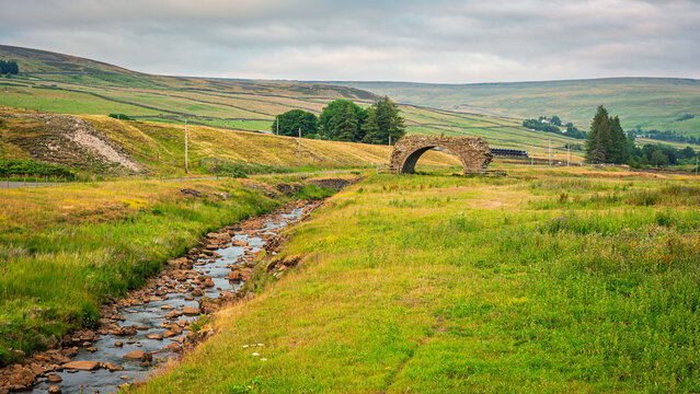 Rookhope Arch all that remains of a Lead Smelting Mill, in the North Pennines a landscape of sweeping  moorlands, renowned for vast open skies, winding rivers and historic stone buildings