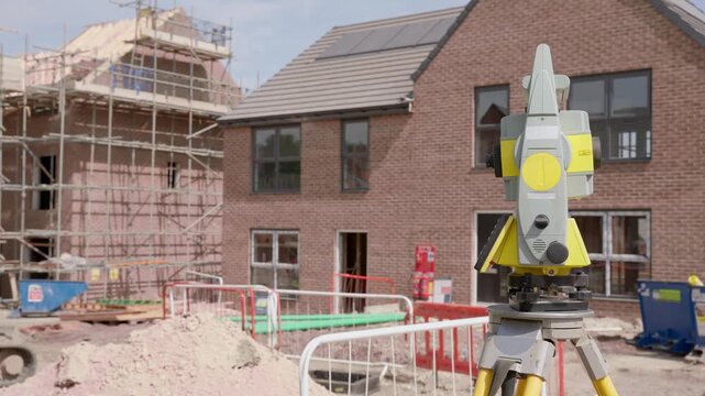 Construction site shows leveling tools and work progress on a building project in midday sun