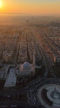 Scenic aerial drone view of an Islamic mosque at sunrise. Urban landscape during the holy month of Ramadan and Eid