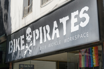 Fototapeta premium exterior building facade and sign of Bike Pirates, a bicycle repair shop, located 1564 Bloor St W, Toronto