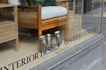 Fototapeta premium text at bottom of display window at Absolutely Inc, an interior designer, located at 1236 Yonge St, Toronto