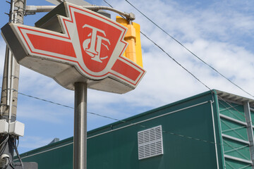 Fototapeta premium TTC insignia pylon outside entrance to Osgoode station, line 1, Toronto (University Av)