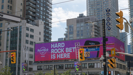 Fototapeta premium digital sign facing Sankofa Square for Hard Rock Bet, an online gambling app, Toronto