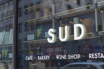 Fototapeta premium channel lettering sign mounted to display window at Sud Forno, a restaurant, located at 132 Yonge St, Toronto
