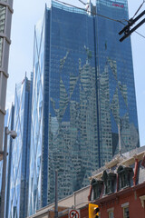 Fototapeta premium north elevation of CIBC Square, designed by WilkinsonEyre + Adamson Associates, in a neo-futurist, commercial high-rise, completed 2021/25, located at 81 and 141 Bay St, Toronto
