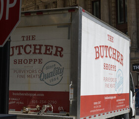 Fototapeta premium The Butcher Shoppe box truck delivery vehicle in downtown Toronto