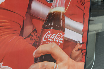 Fototapeta premium mesh advertising banner at a convenience store for Coca-Cola, Toronto