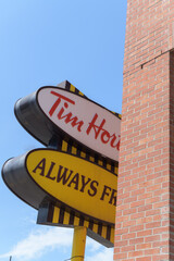 Fototapeta premium obstructed view of an iconic Tim Hortons pylon (Always Fresh oval background design) at 1728 Bloor St W, Toronto