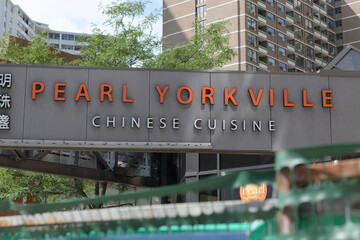 Fototapeta premium sign outside Pearl Yorkville Chinese Cuisine, a restaurant, located at 730 Yonge St (inside Charles St Promenade), Toronto