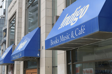 Fototapeta premium awnings with signs over windows at Indigo, a book store chain, located here at 2300 Yonge St (Yonge Eglinton Centre), Toronto