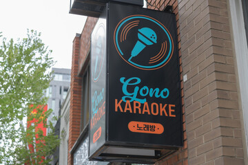 Fototapeta premium wall-mounted box sign outside GONO Karaoke, a bar, located at 2156 Yonge St, lower unit, Toronto