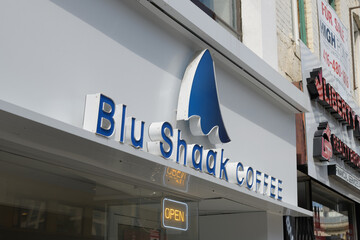 Fototapeta premium exterior building facade and sign of Blu shaak coffee located at 684 Yonge St, Toronto