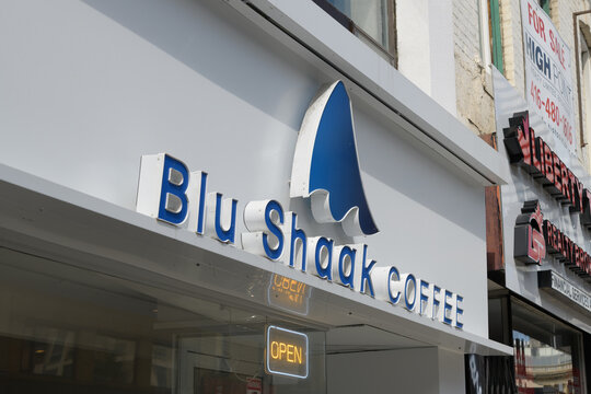exterior building facade and sign of Blu shaak coffee located at 684 Yonge St, Toronto