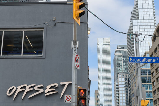 looking north on Yonge St to sign outside Offset Bar / Caf&eacute; and (in the distance) One Bloor East from Breadalbane St, Toronto