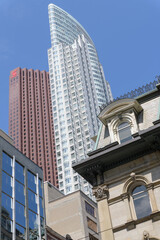 Fototapeta premium historic office building with Second Empire windows (known as British Colonial Building at 49 Yonge St and 8 Wellington St E) contrast with the Silver Tower and Scotia Plaza, Toronto
