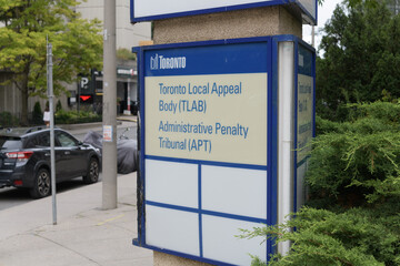 Fototapeta premium sign at the Toronto Local Appeal Body (TLAB) and Administrative Penalty Tribunal (APT) located at 40 Orchard View Boulevard, 2nd floor