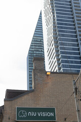 Fototapeta premium wall mounted sign outside Niu Vision Optical located at 3 Irwin Av, Toronto