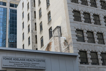 Fototapeta premium ghost sign of Yonge Adelaide Health Centre at 119 Yonge St, Toronto