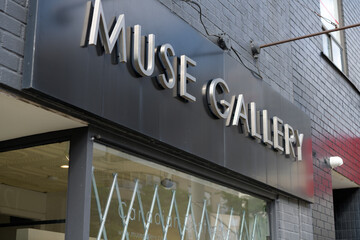 Fototapeta premium sign over display window and entrance to Muse Gallery located at 1230 Yonge St, Toronto