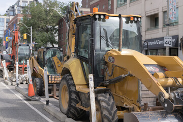 Fototapeta premium excavator on a construction site on Yonge St in Toronto