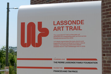 Fototapeta premium The Lassonde Art Trail (LAT) sign at Biidaasige Park, Port Lands, Toronto (near plaza of Old Firehall 30)