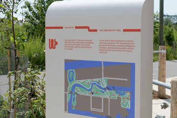 Naklejka premium The Lassonde Art Trail (LAT) sign at Biidaasige Park, Port Lands, Toronto (plaza of Old Firehall 30)
