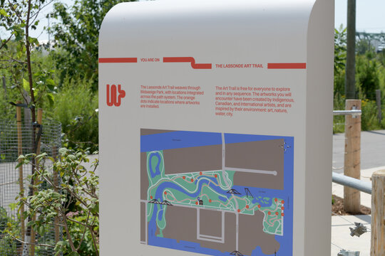 The Lassonde Art Trail (LAT) sign at Biidaasige Park, Port Lands, Toronto (plaza of Old Firehall 30)