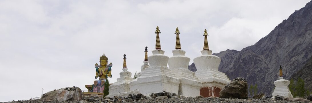 Buddha statue of Cho Rinpoche and stupas at Diskit monastery in Ladakh, India
