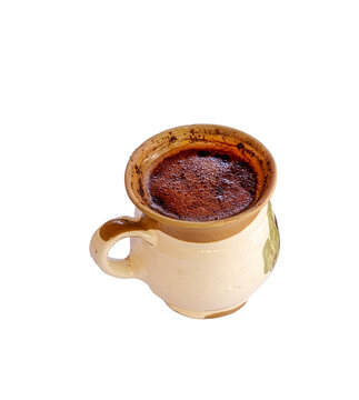 a rustic ceramic cup of freshly brewed coffee