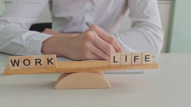 Balance between work and life in a simple setup with wooden blocks