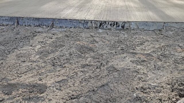 Concrete setting in a construction site showing various stages of the process