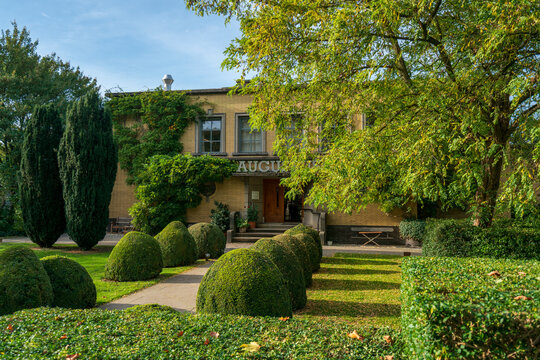 Dordrecht, Netherlands &ndash; October 19, 2025: Historic Villa Augustus surrounded by manicured topiary, mature trees, and landscaped gardens on a bright summer day, classic Dutch architecture exterior