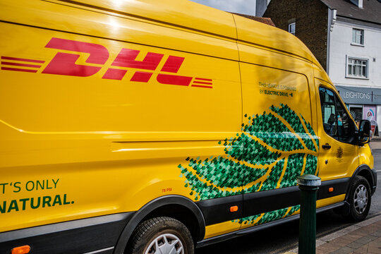 Close-Up Of An Electric Powered DHL Courier Delivery Van Parked On A Public Road