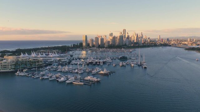 Horizontal aerial footage trucking right over Southport Marina, Surfers Paradise and the Gold Coast Marathon, Queensland, Australia