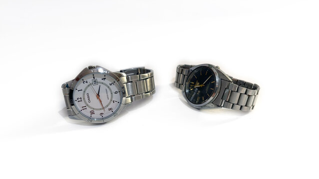 Kediri, East Java, Indonesia &ndash; August 16, 2026: Pair of Metallic Wristwatches with Dark and White Dial Displayed Side by Side