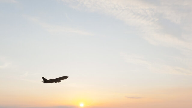 Commercial passenger airplane flying through the sky and taking off, ideal for aviation, air travel, tourism, transportation, airline, and travel content.