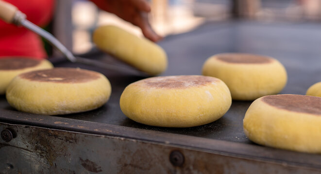 Bolo do caco bread baking on traditional griddle in madeira