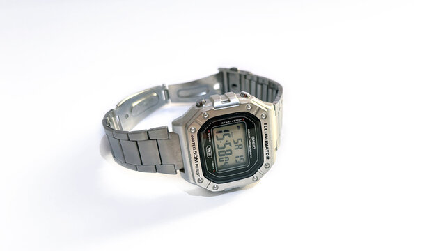 Kediri, East Java, Indonesia &ndash; August 16, 2026: Metallic Wristwatch with Rectangular Digital Face and Perforated Band Photographed on White Background