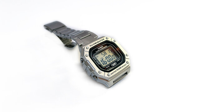 Kediri, East Java, Indonesia &ndash; August 16, 2026: Metallic Wristwatch with Rectangular Digital Face and Perforated Band Photographed on White Background
