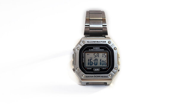 Kediri, East Java, Indonesia &ndash; August 16, 2026: Metallic Wristwatch with Rectangular Digital Face and Perforated Band Photographed on White Background