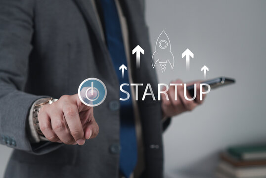 The startup business concept using a digital tablet virtual screen includes an activation icon and organizational growth strategy.
