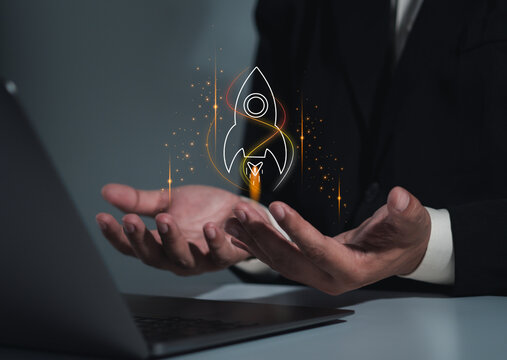 The startup business concept using a digital tablet virtual screen includes an activation icon and organizational growth strategy.