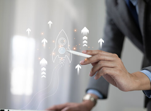 The startup business concept using a digital tablet virtual screen includes an activation icon and organizational growth strategy.