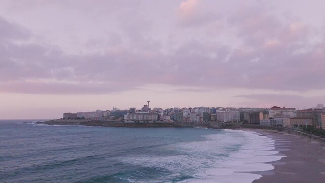 Aerial view of orzan beach coastline at dusk in a coruna, spain