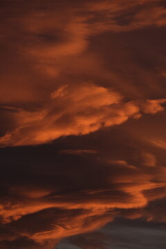 Abstract fiery sunset cloud formation over northern Italy