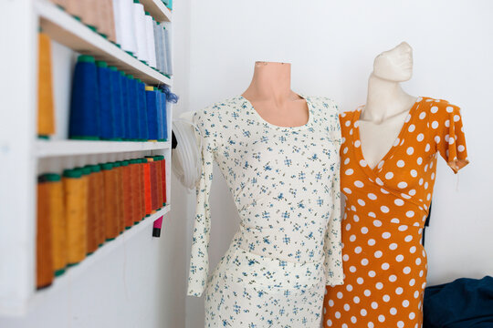 Dresses on mannequins in atelier