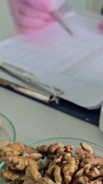 Checking nuts for quality in a lab setting during the day