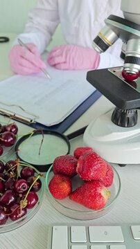 Researching fruits in a lab with a microscope in a bright work space