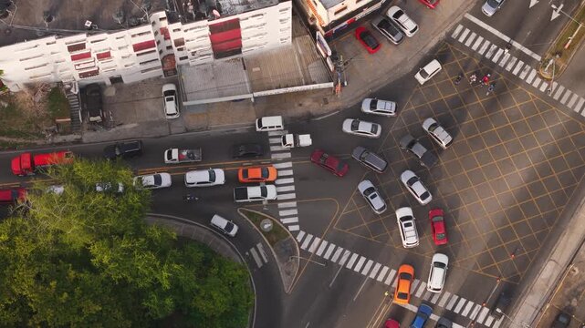 Aerial view of Avenida de los Proceres with cars waiting at a yellow grid box junction in Santo Domingo, Distrito Nacional, Dominican Republic.