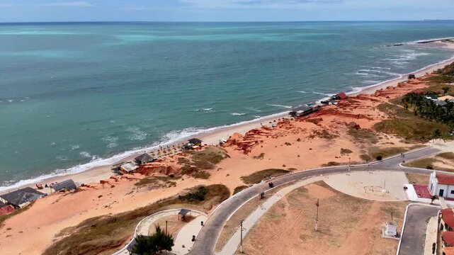 Aerial View of Coastal Plaza and Beach with Red Cliffs, Canoa Quebrada